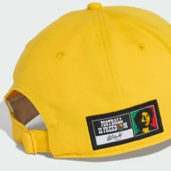 adidas Kopfbedeckungen|Kopfbedeckungen<· Jamaika 26 x Bob Marley Baseball Kappe Bold Gold / Black