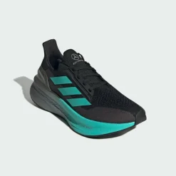 adidas Laufschuhe<· Mercedes - AMG Petronas Formula One Core Black / Semi Mint Rush / Iron Metallic