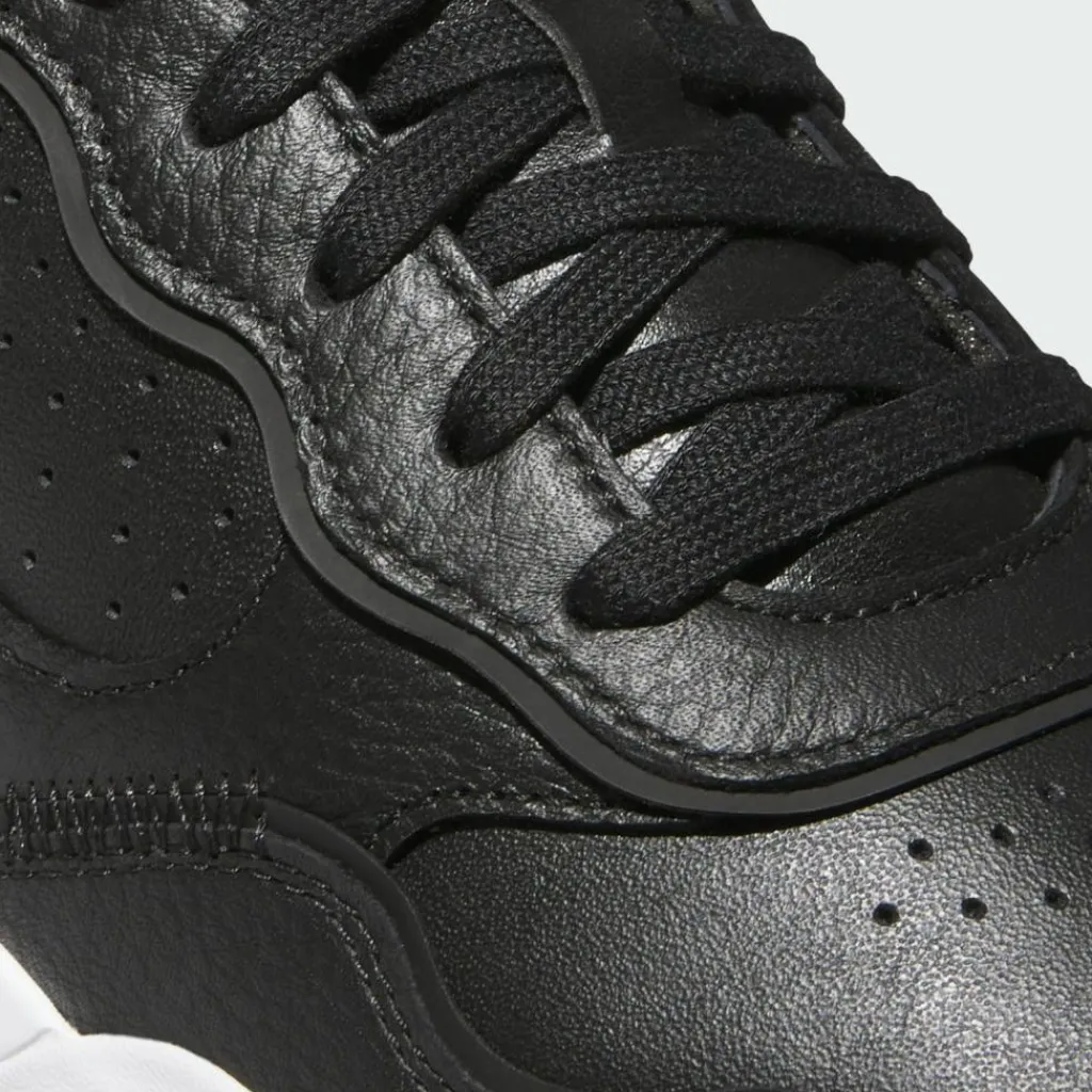 adidas Multifunktionsschuhe<· Retrocross 25 Spikeless Golfschuh Core Black / Cloud White / Gum